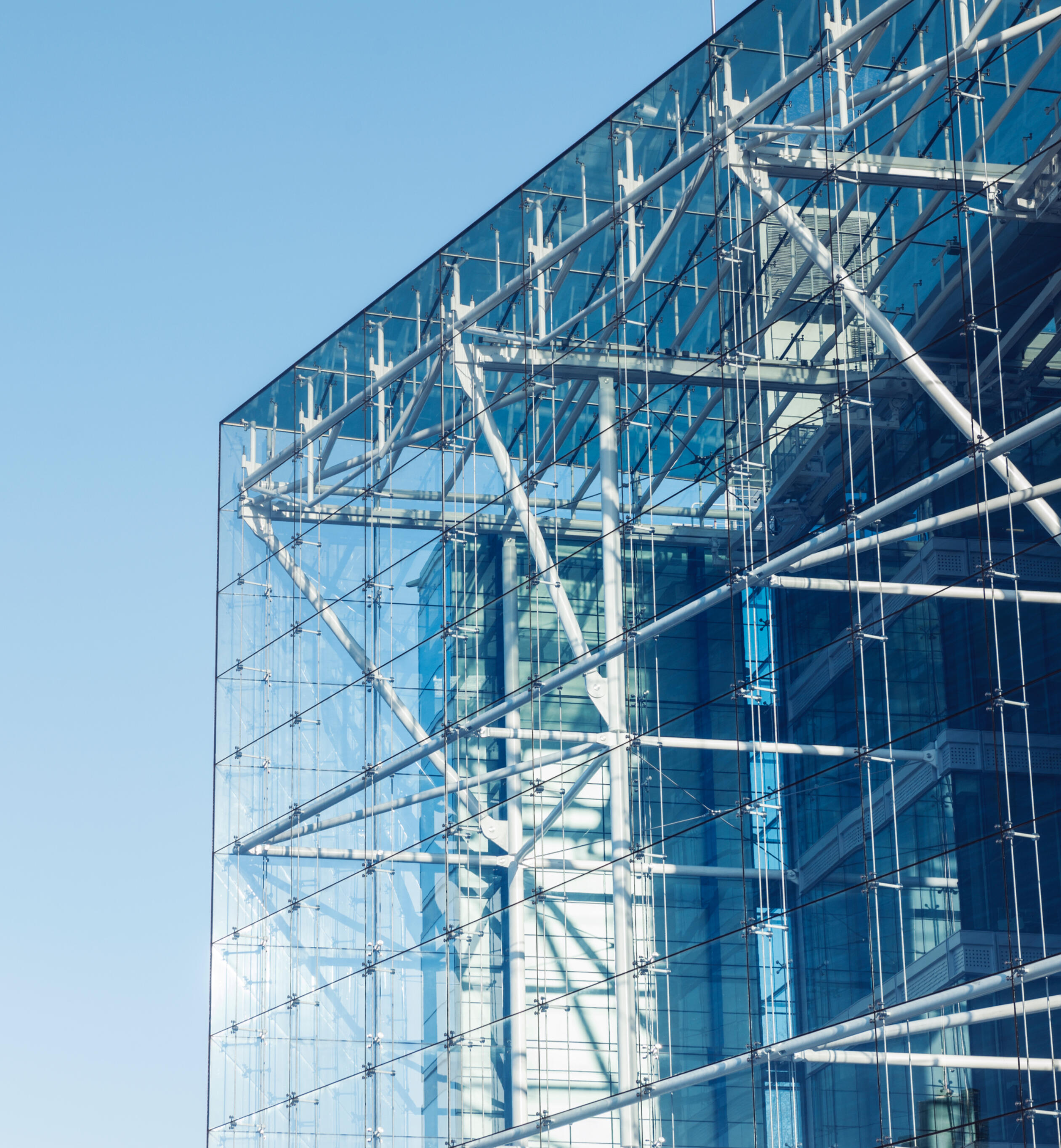 Organizational Structure and Leadership Alignment Modern glass building representing Mie Rajcic's leadership philosophy of structural alignment, clarity, and strong organizational systems